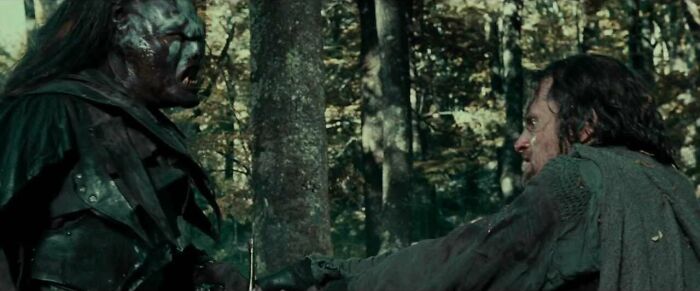 Aragorn fighting with Uruk Hai