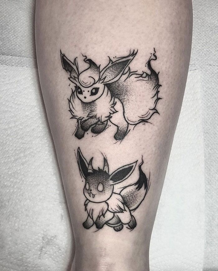 Unique calf tattoo featuring stylized ink characters, showcasing cool design elements.