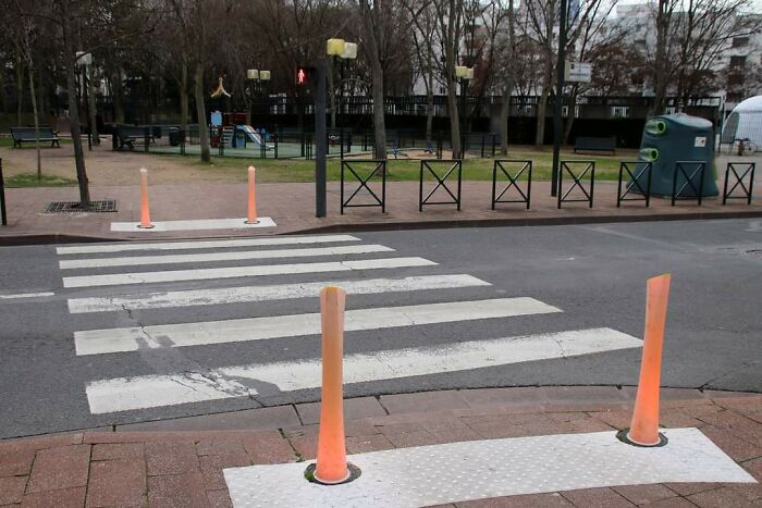 Luminous Bollards That Change Of Color Depending Of The Pedestrian Signal Color. La Défense, France