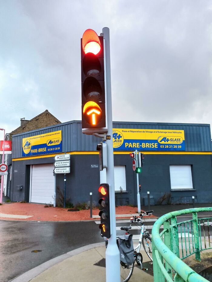 Yellow Arrow In France. Allow You To Run A Red Light If You Go In The Same Way Than What The Arrow Indicate