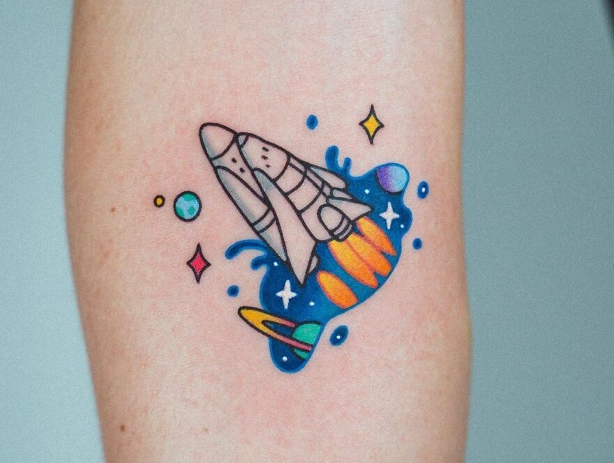 Cute colorful spaceship tattoo
