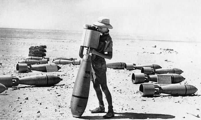 This Armorer Of The R.a.f.'s Middle East Command Prepares A Bomb For Its Mission Against The Italian Forces Campaigning In Africa