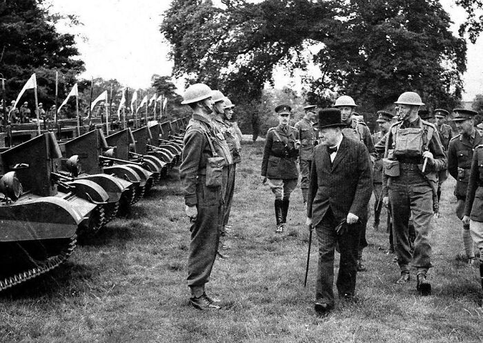 British Prime Minister Winston Churchill Inspects Britain's Grenadier Guards Standing At Attention In Front Of Light Bren Gun Armored Units In July Of 1940