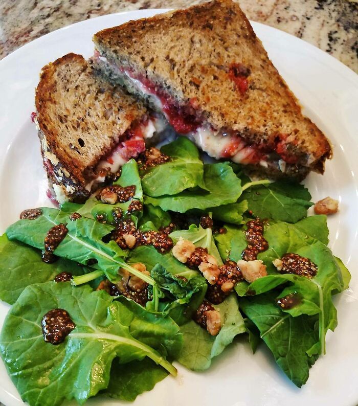 Brie and jam sandwich with greens