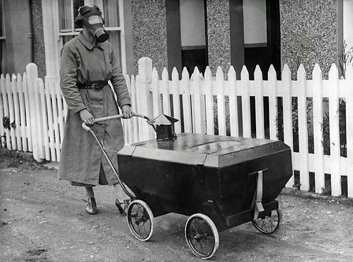 Pictured Aboved Is A Woman Wearing A Gas Mask And Pushing A Gas-Resistant Pram In England During 1938