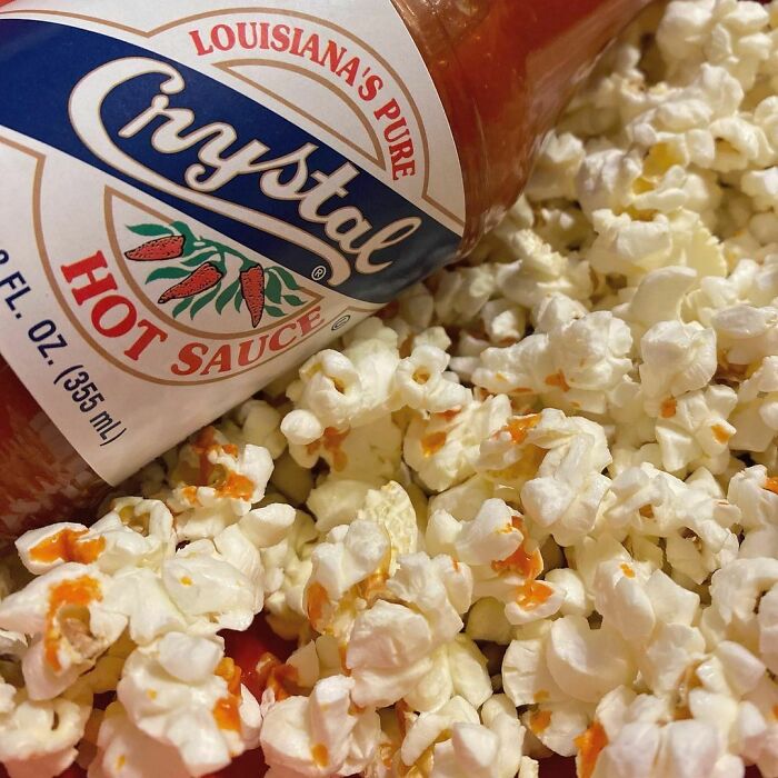 Popcorn and bottle of hot sauce