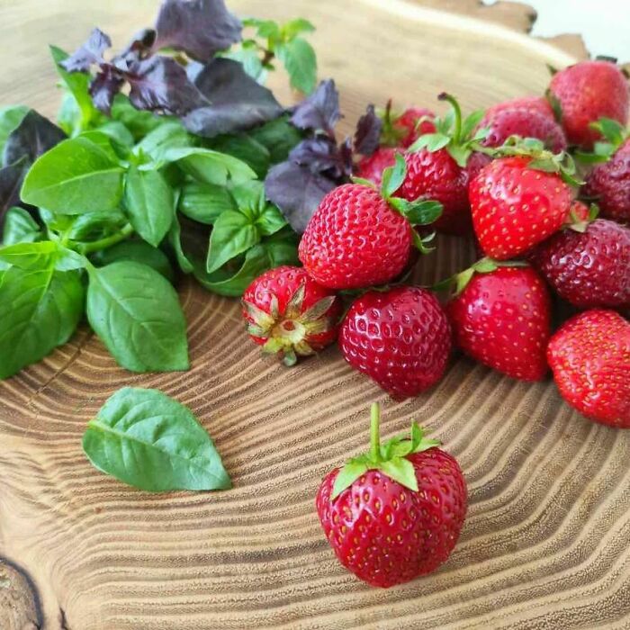 Strawberries and basil leaves