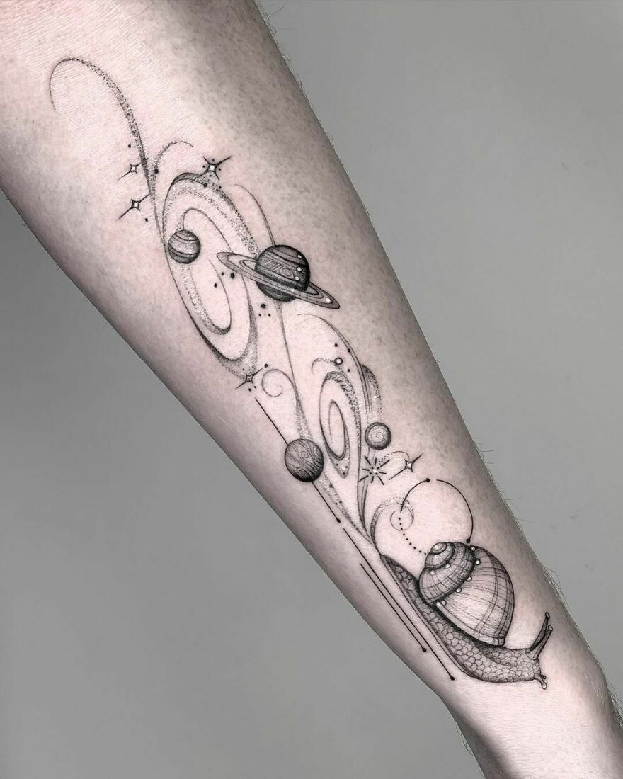 Space Snail with planets arm tattoo