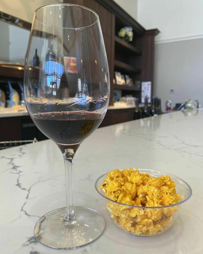 Popcorn and glass of wine