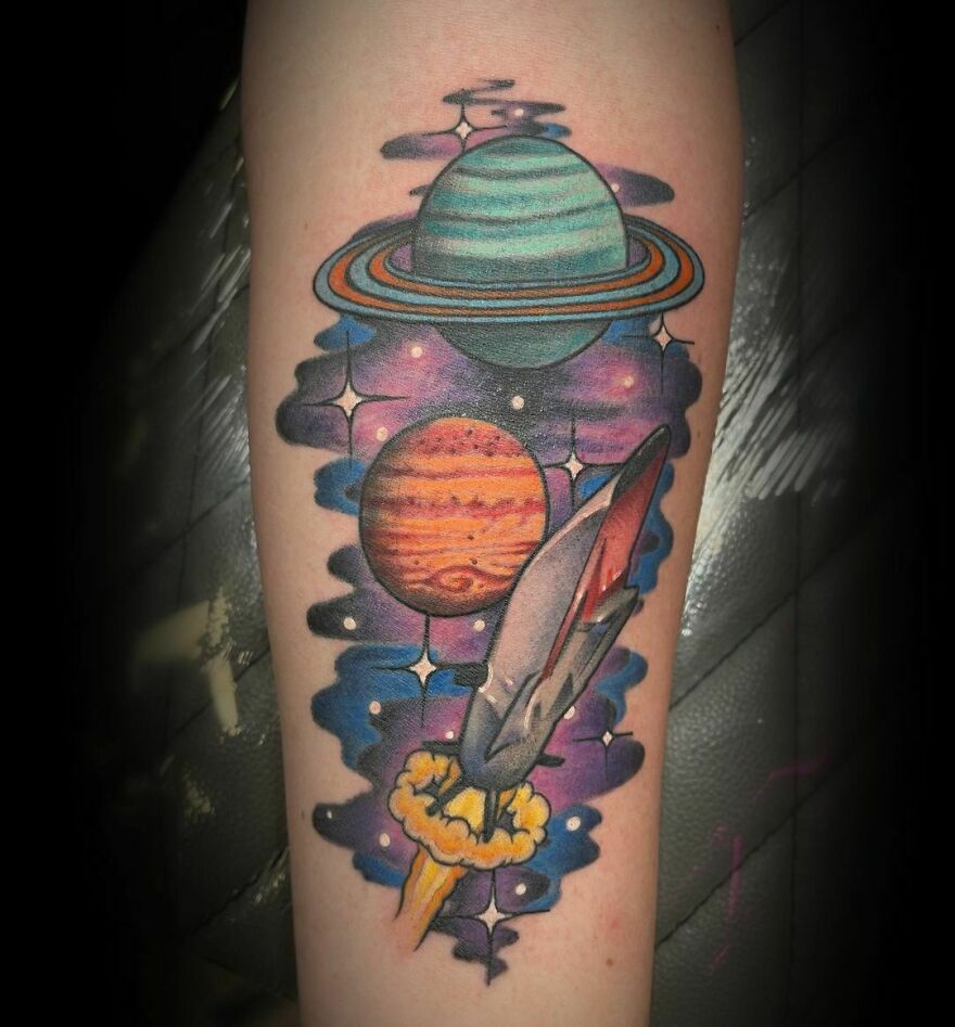 Colorful planets in a galaxy background tattoo