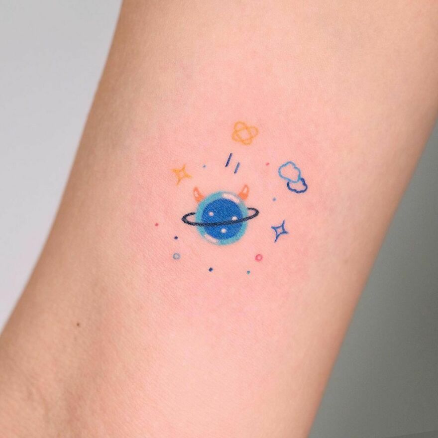 Cute tiny space tattoo
