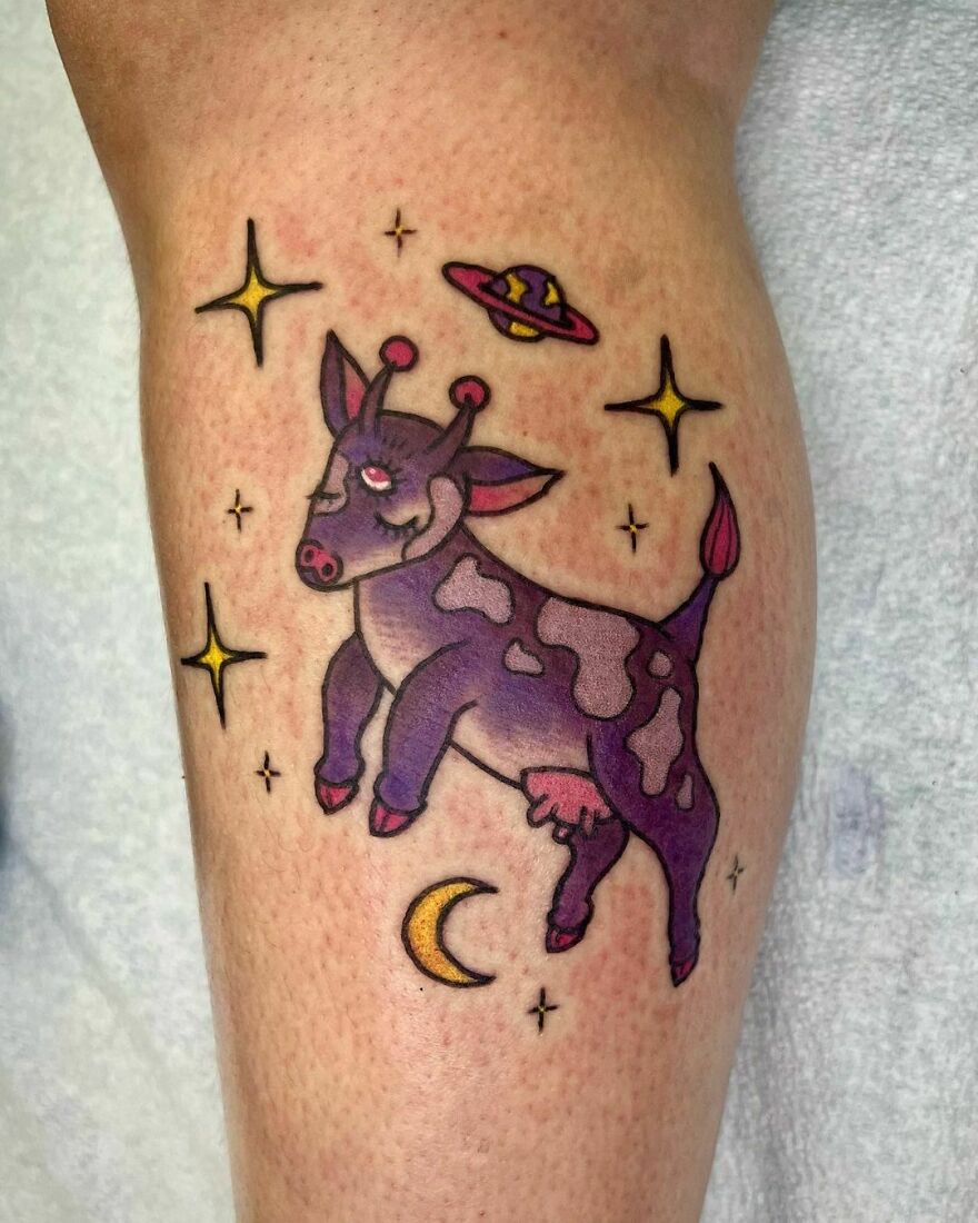 Cute colorful alien cow in space tattoo
