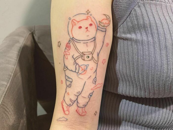 Space cat arm tattoo