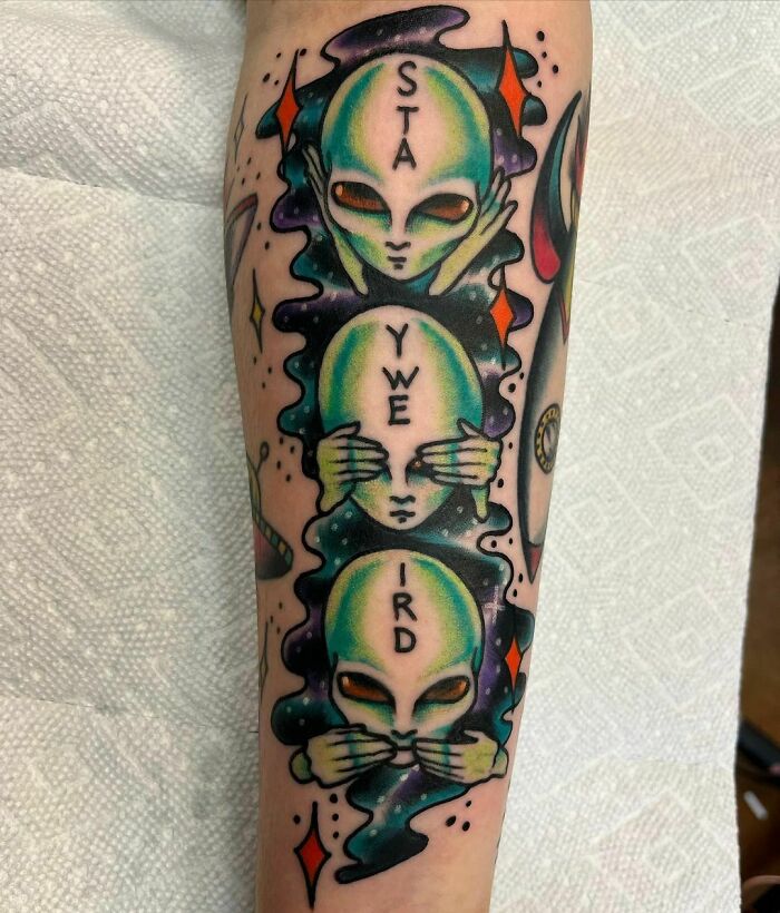 Aliens arm tattoo