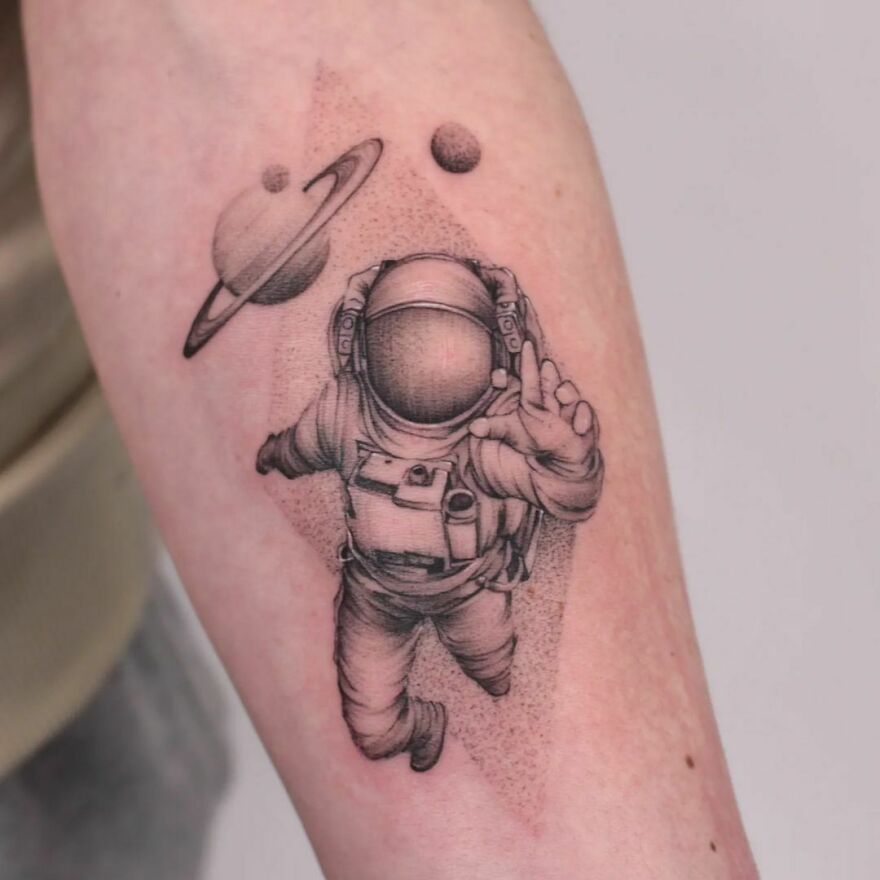 Astronaut and planets forearm Tattoo