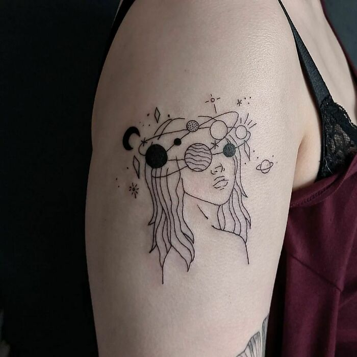 Lady and planets arm tattoo