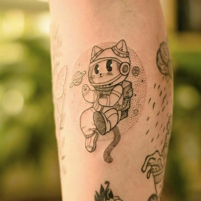 Space cat arm tattoo