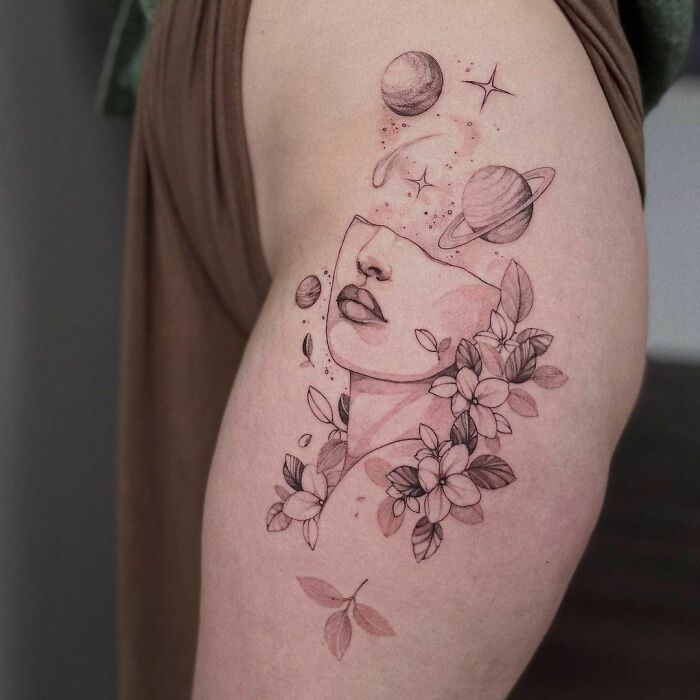 Floral space lady and planets leg tattoo