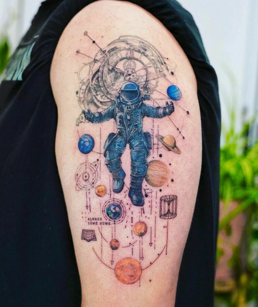 Astronaut and planets arm tattoo