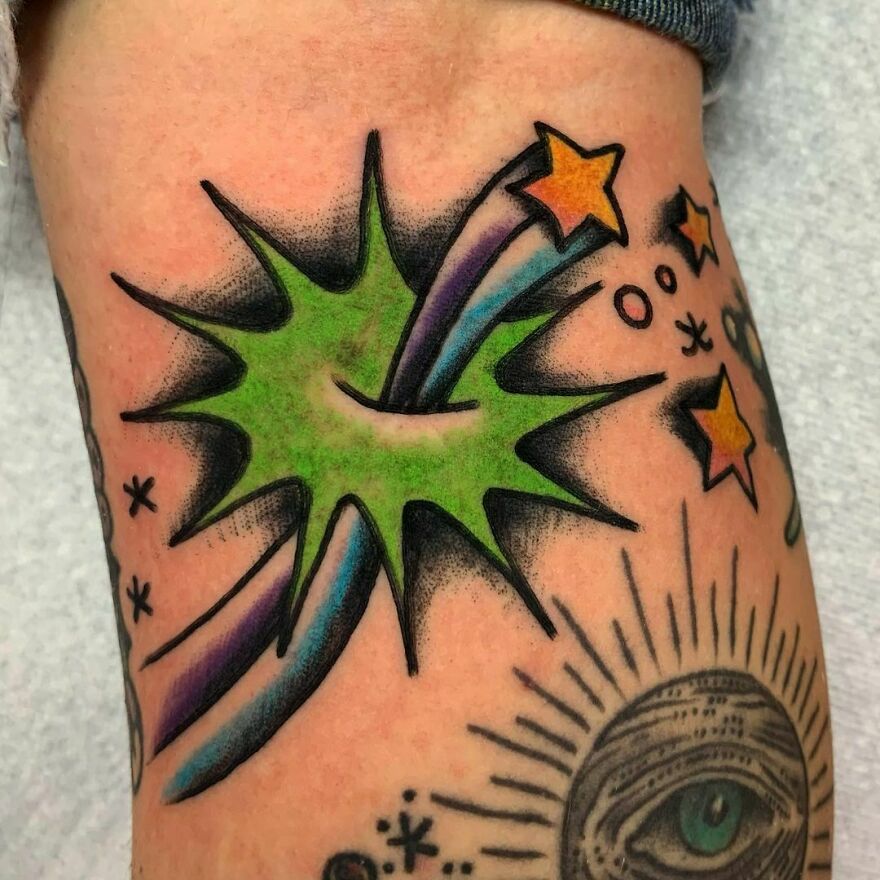 Comic style colorful shooting star tattoo