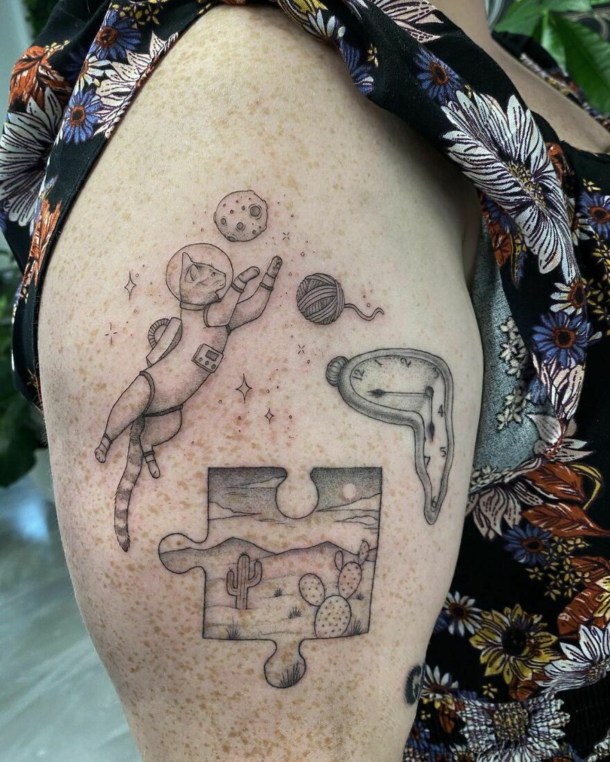 Cat astronaut arm tattoo