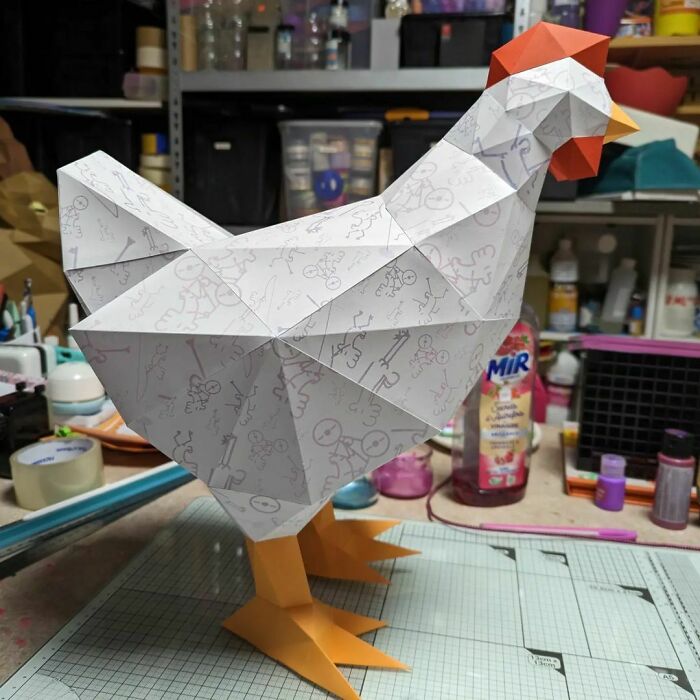 a hen made out of a paper on the table