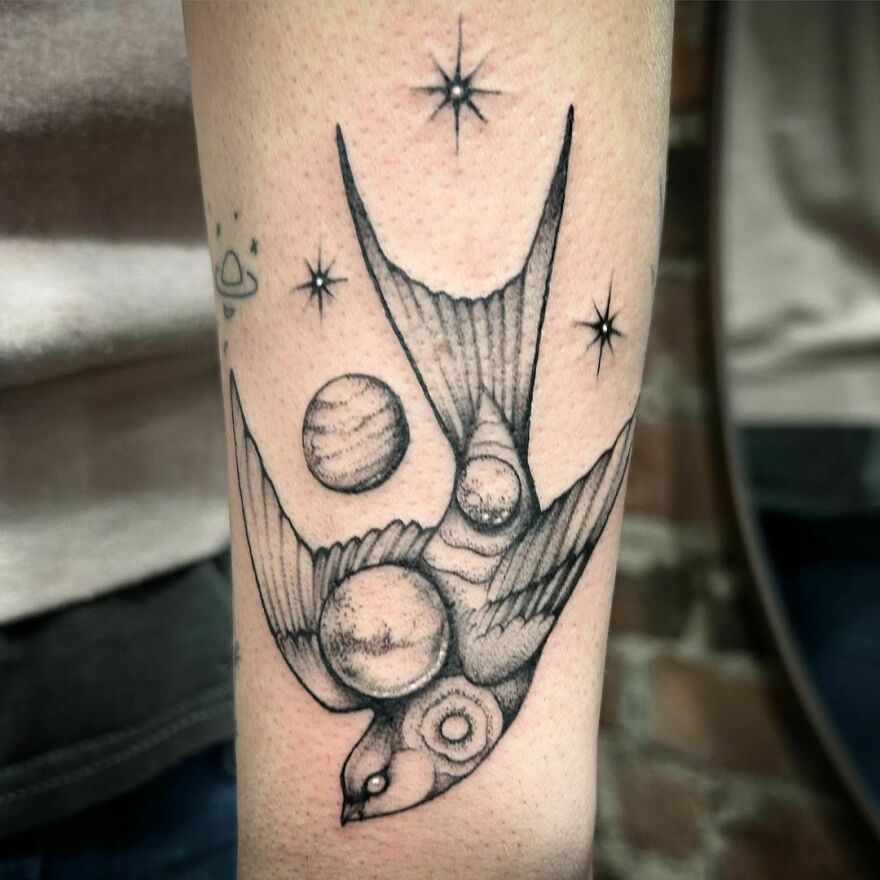 Space swallow tattoo