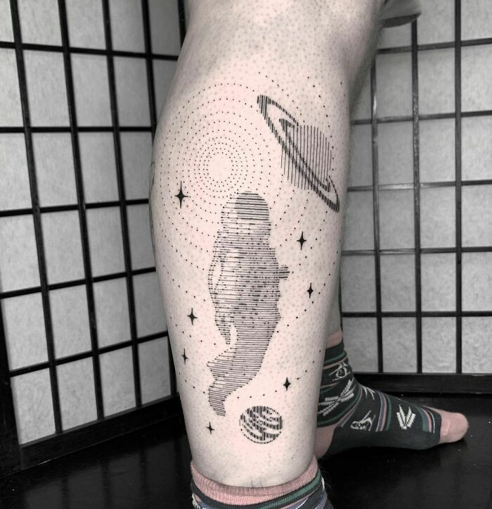 Astronaut in space tattoo