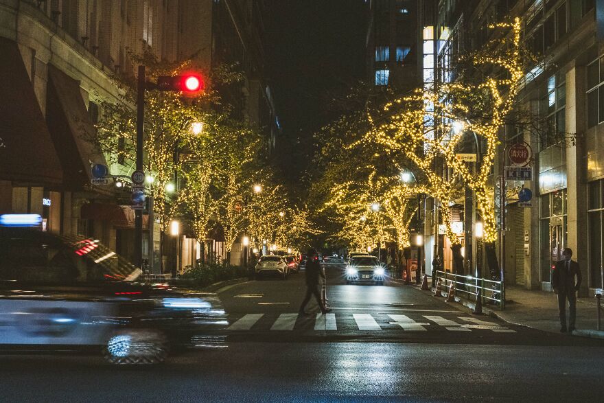 Transient Encounters: Ginza's Illuminated Streets And Rushing Taxis
