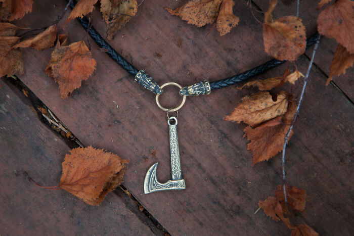 Hatchet With Celtic Ornaments On Black Leather Cord With Dragon Heads