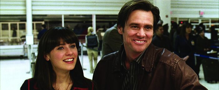 Two actors smiling at an airport scene, representing some of the highest-paid actors in the entertainment industry.