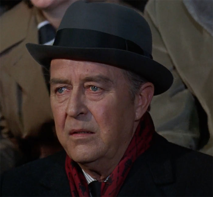 Ray Milland wearing hat and looking in movie