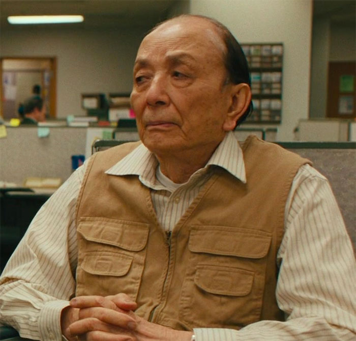 James Hong sitting and looking in movie