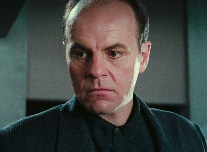 Michael Ironside standing and looking