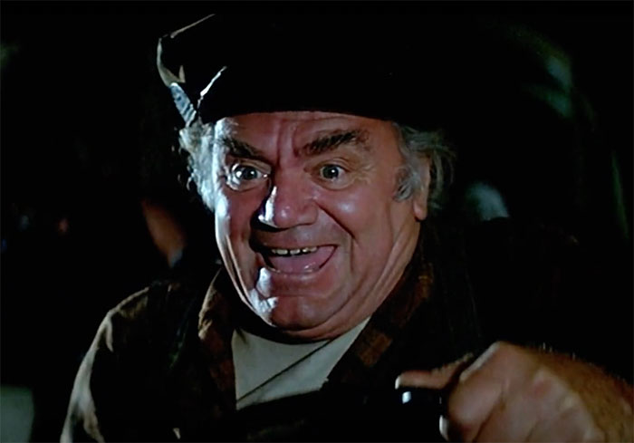 Ernest Borgnine wearing hat and smiling in movie