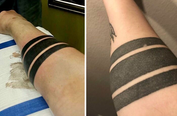 Two thick black armband tattoos on an arm, showing the aging process of tattoos over time.