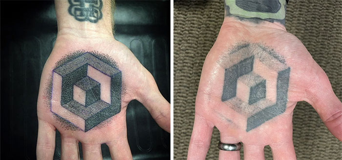 Aged tattoos on a hand showing geometric design fading over years.