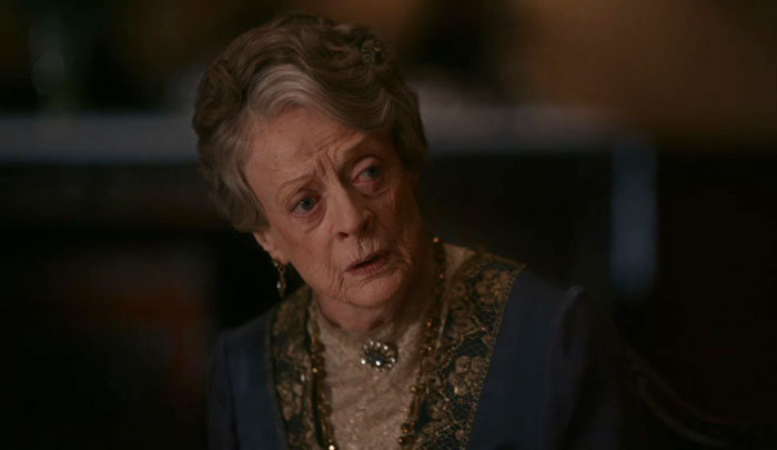 Violet Crawley from Downton Abbey wondering with her mouth slightly open