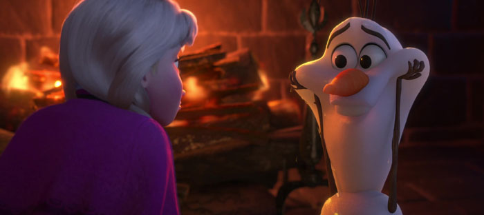 Olaf looking happy at Anna in the background of a fireplace