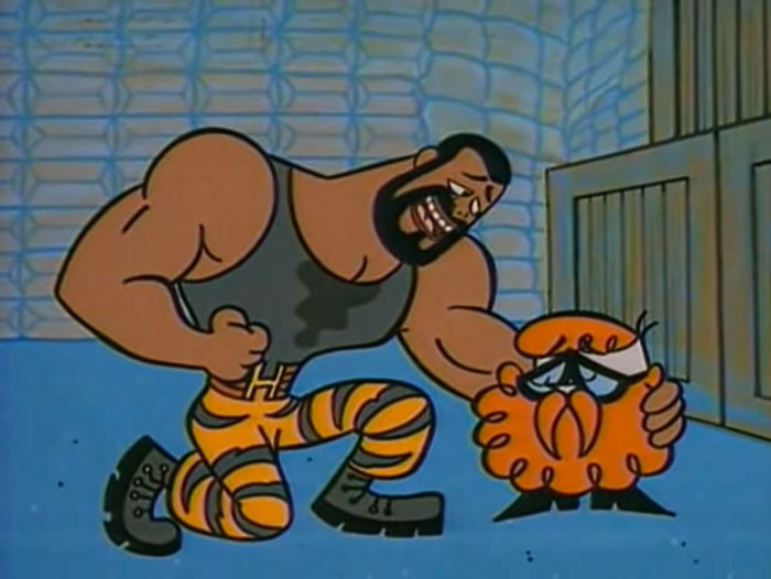 Cartoon character with a beard and muscular build comforts a small orange creature in a cell, illustrating real-life situations.