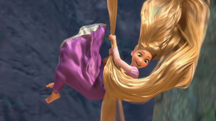 Rapunzel letting down on her hair and smiling