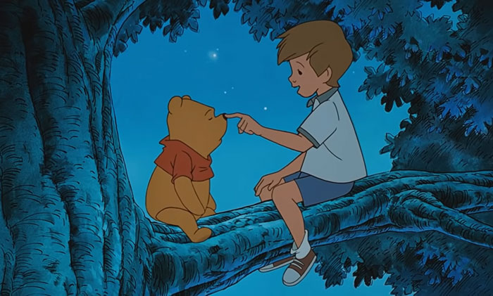 Winnie The Pooh and Christopher Robin sitting on a tree branch in a night sky