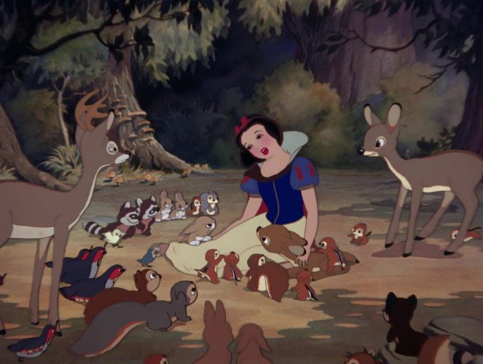 Snow White singing to animals in the forest