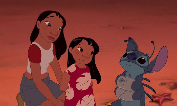 Two girls and an alien character from a cartoon sit on a beach, illustrating a real-life situation.