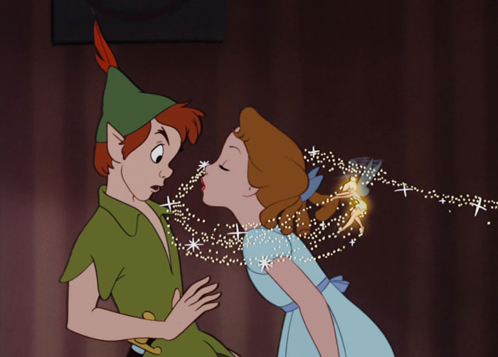 Peter Pan and Wendy Darling with Tinker Bell throwing pixie dust on her