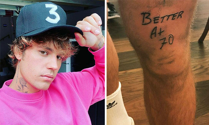 Young man in pink sweatshirt and cap next to leg with "Better At 70" celebrity tattoo.
