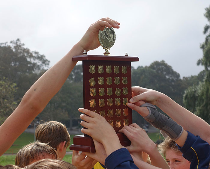 People holding a trophy