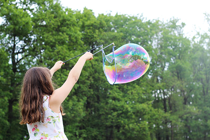 Girl making large bubble