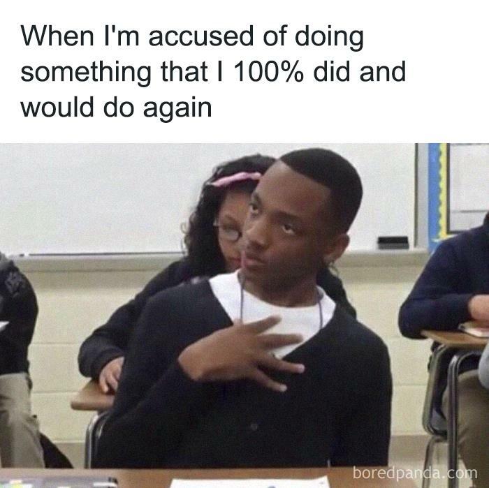 Person in classroom expressing defiance, embodying a humorous meme about being single.