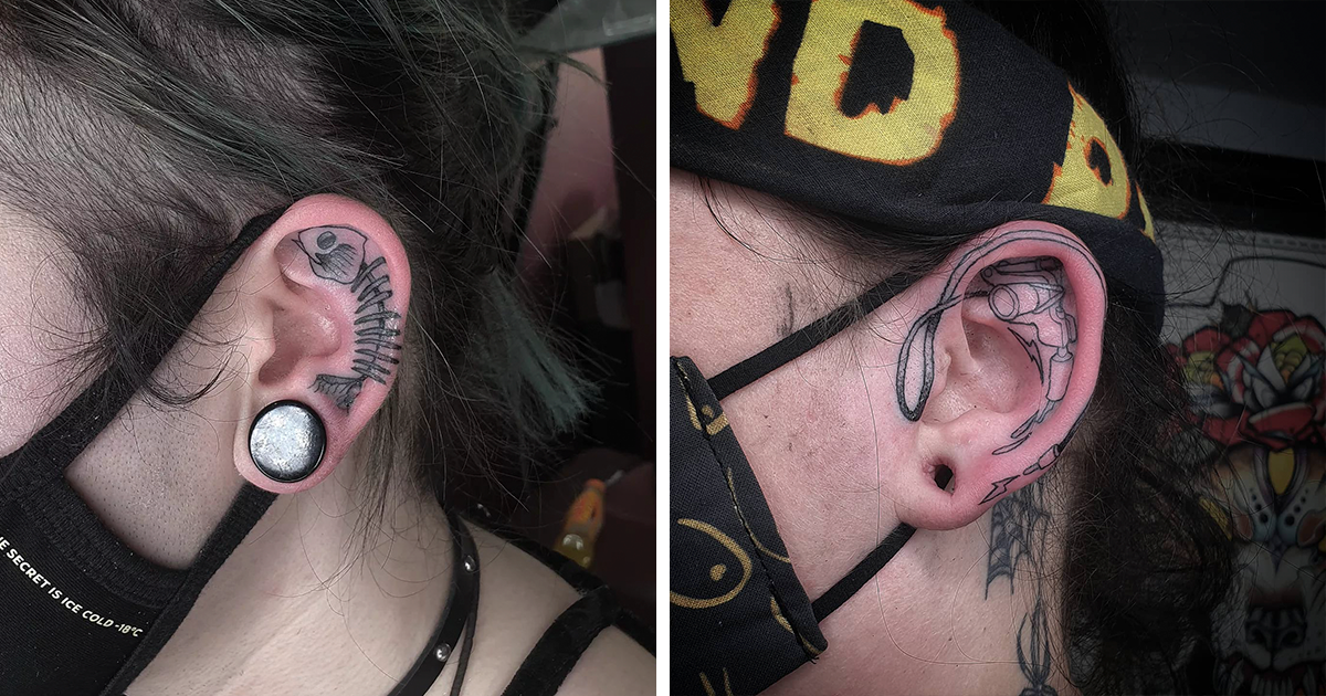 Spider tattoo behind the right ear